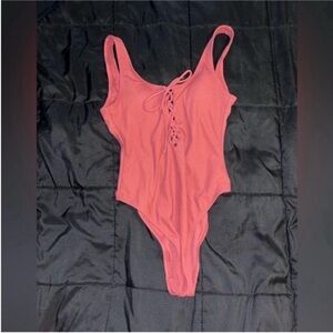 Xhiliration Lace-Up One-Piece Swimsuit in Coral Pink